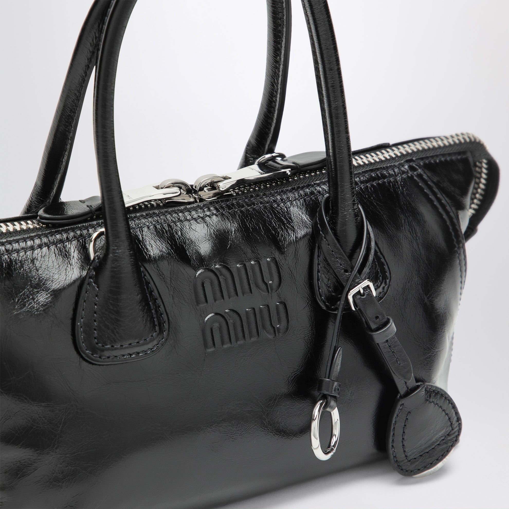 Black glossy leather top-handle bag