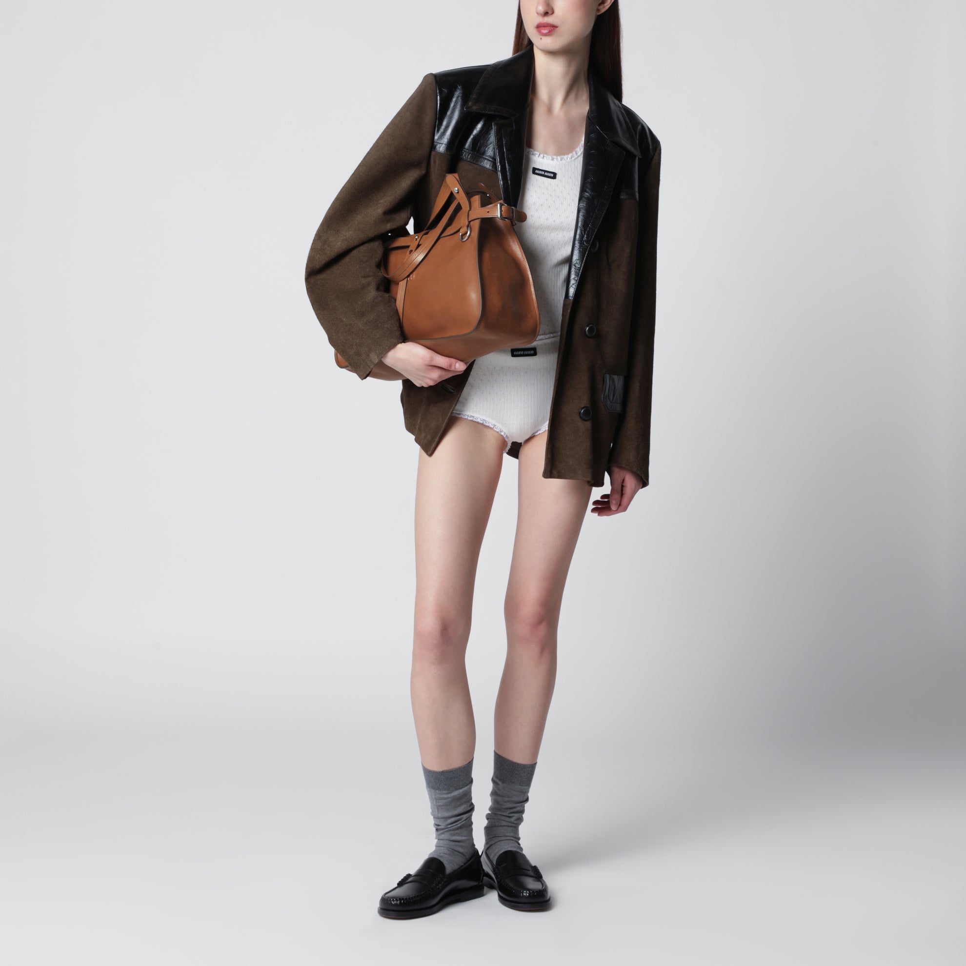 Calfskin crossbody bag with embossed logo in cognac