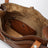 Calfskin crossbody bag with embossed logo in cognac