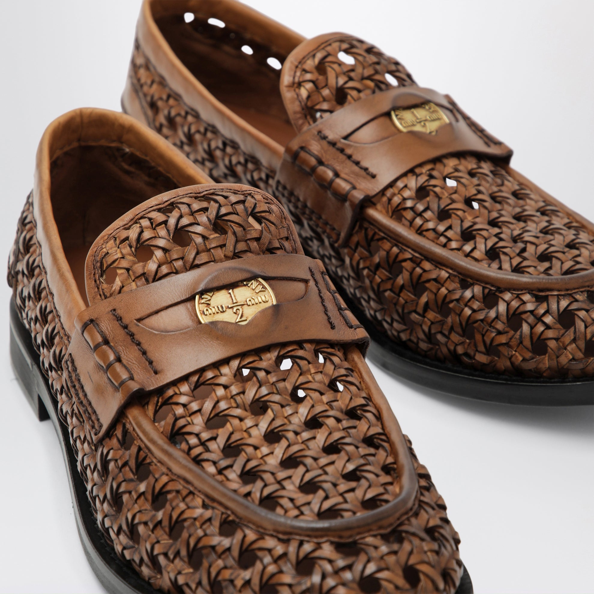 Mocassins penny en cuir tressé couleur cognac