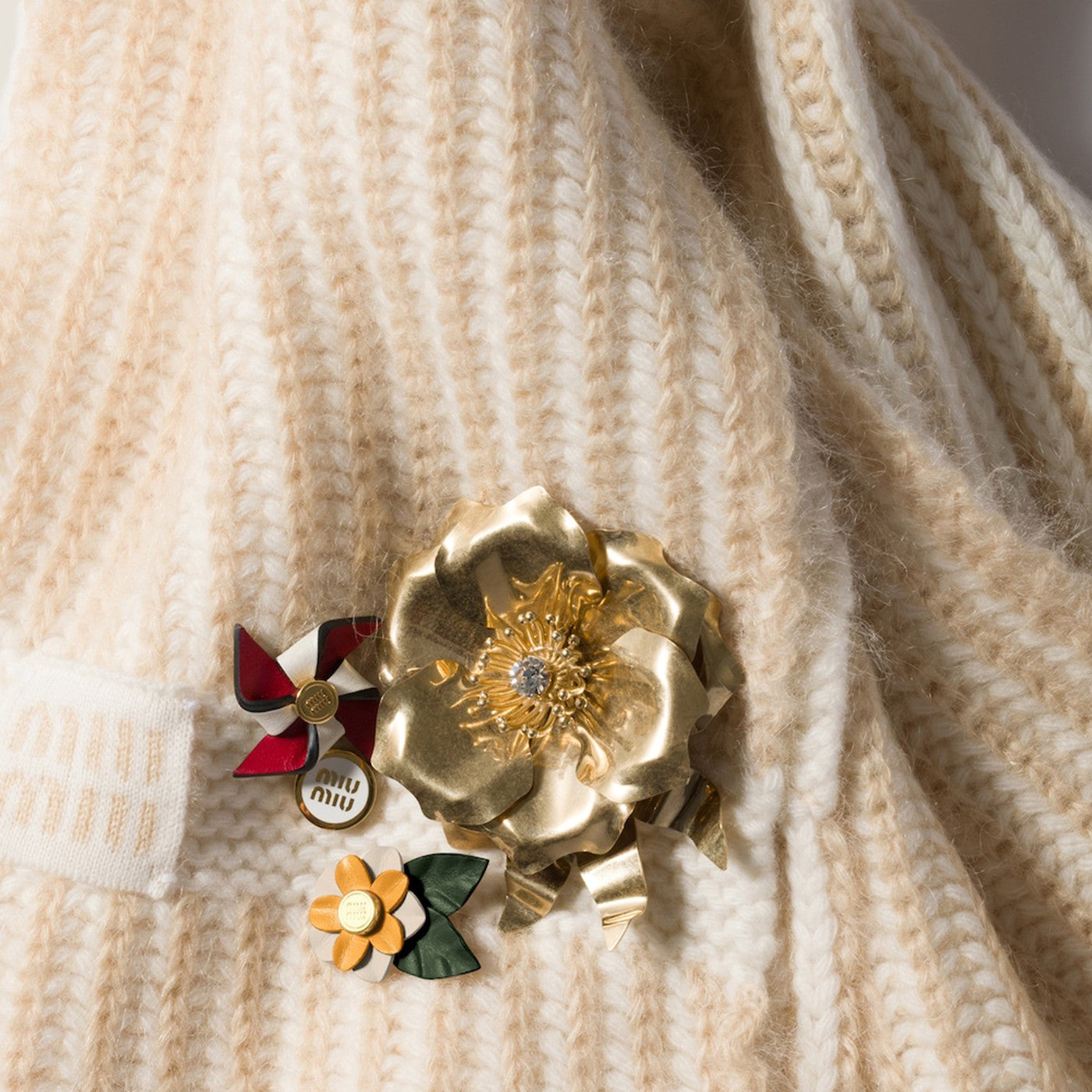 Gold-tone metal brooch with crystal