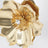 Gold-tone metal brooch with crystal
