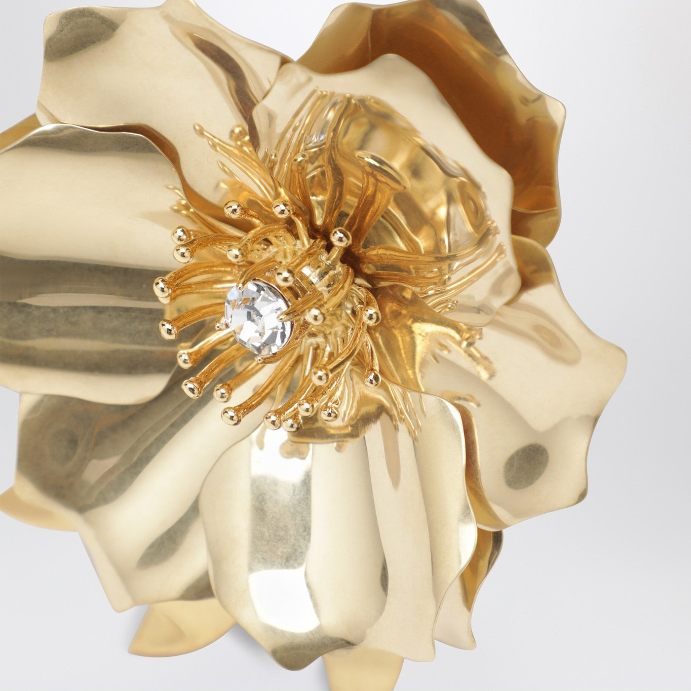 Gold-tone metal brooch with crystal