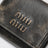Coffee-coloured three-compartment wallet with a vintage look