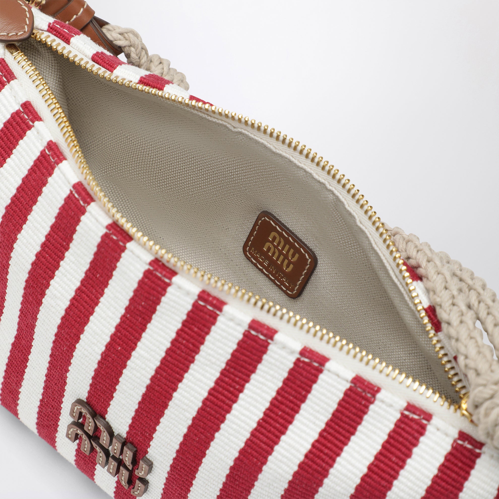 Pochette rayée en coton jacquard et cuir rubis cognac