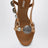 Honey-colored leather sandals with metal details