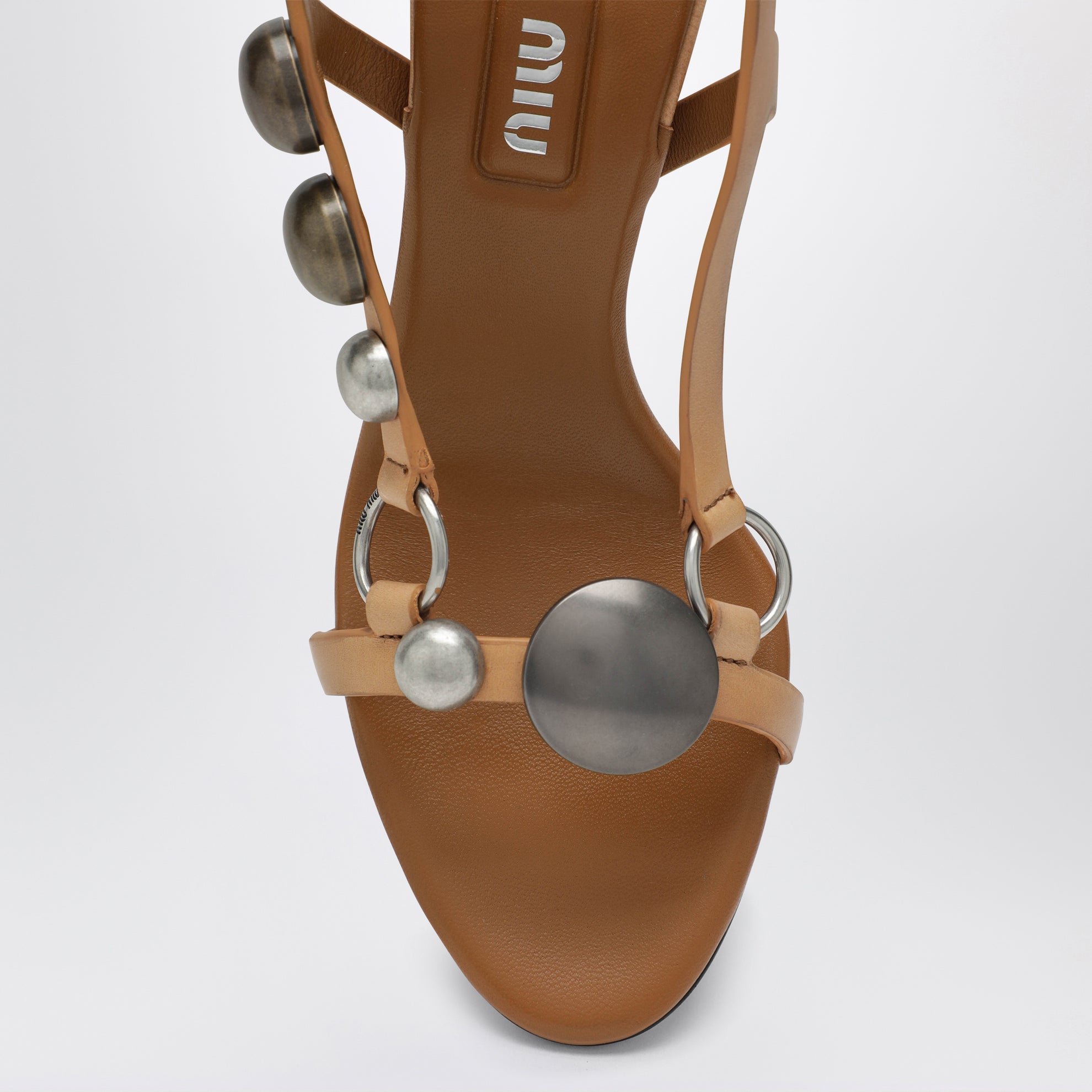 Honey-colored leather sandals with metal details