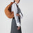 Sac Jodie en daim Intrecciato couleur ambre