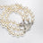 Bracciale Orb platino a tre giri con perle