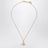 Orb pendant necklace in gold-tone metal with crystals