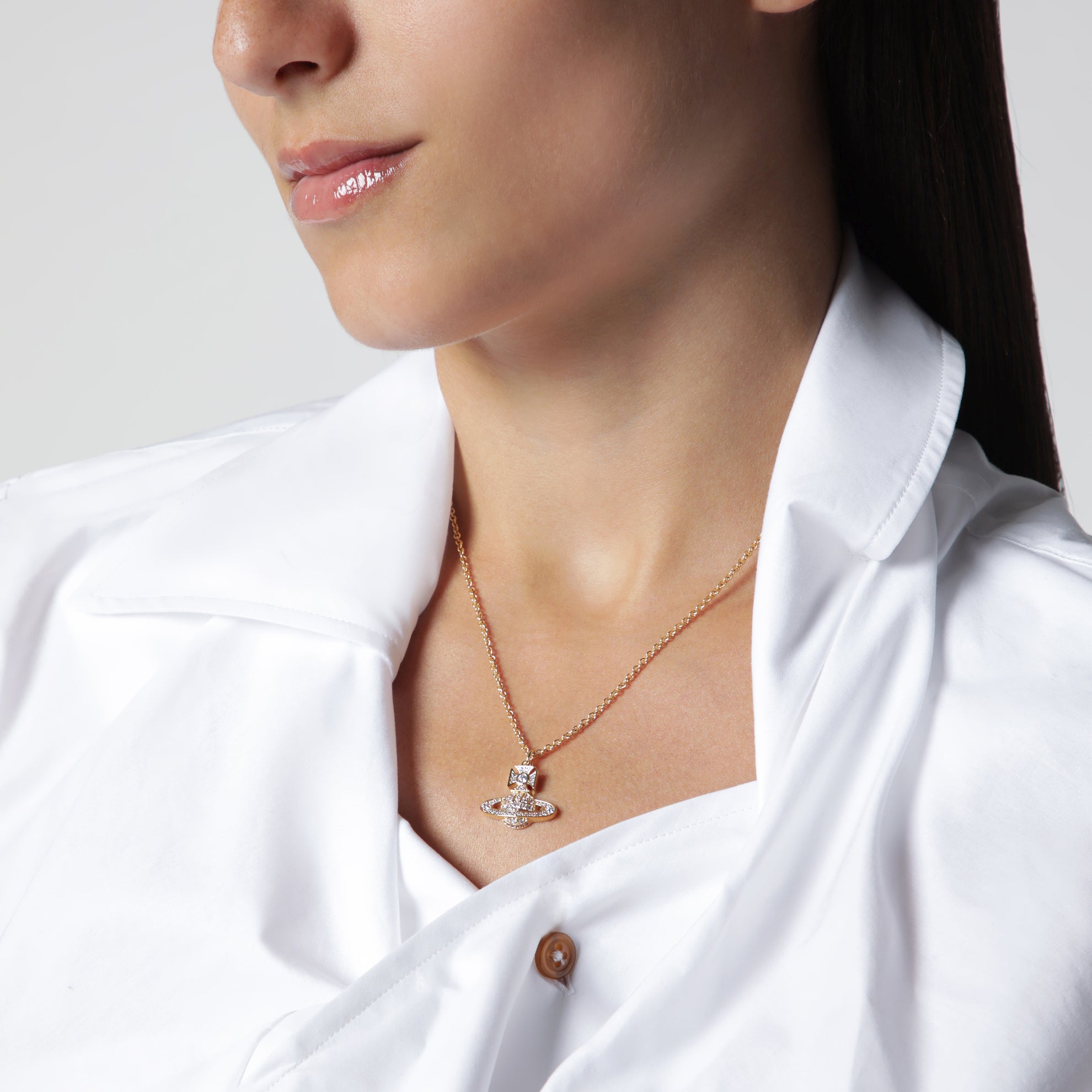 Orb pendant necklace in gold-tone metal with crystals