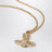 Orb pendant necklace in gold-tone metal with crystals