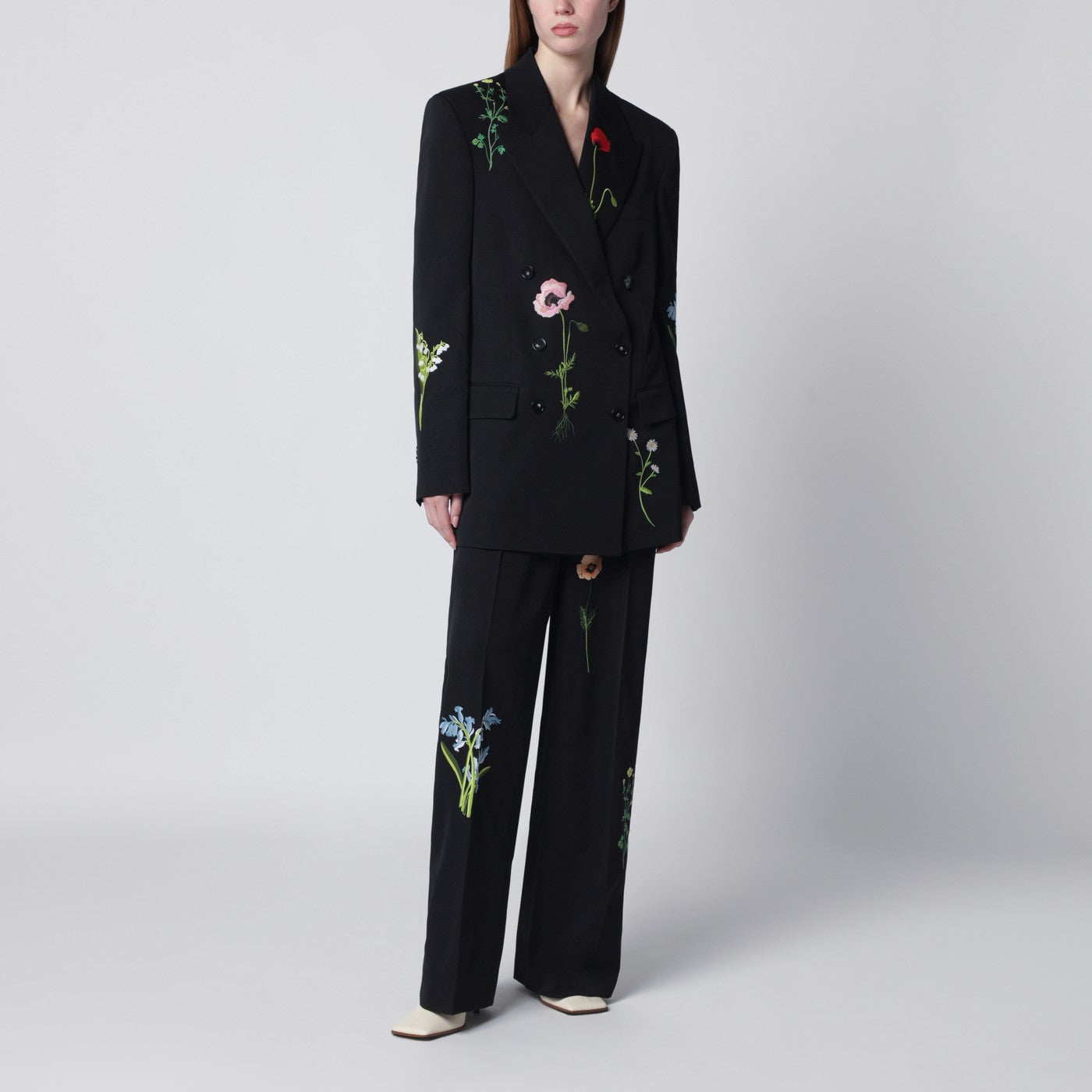 Black wool trousers with floral embroidery