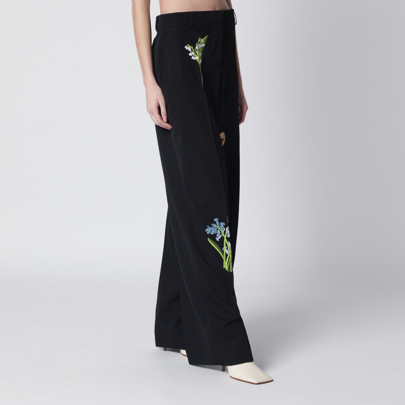 Black wool trousers with floral embroidery