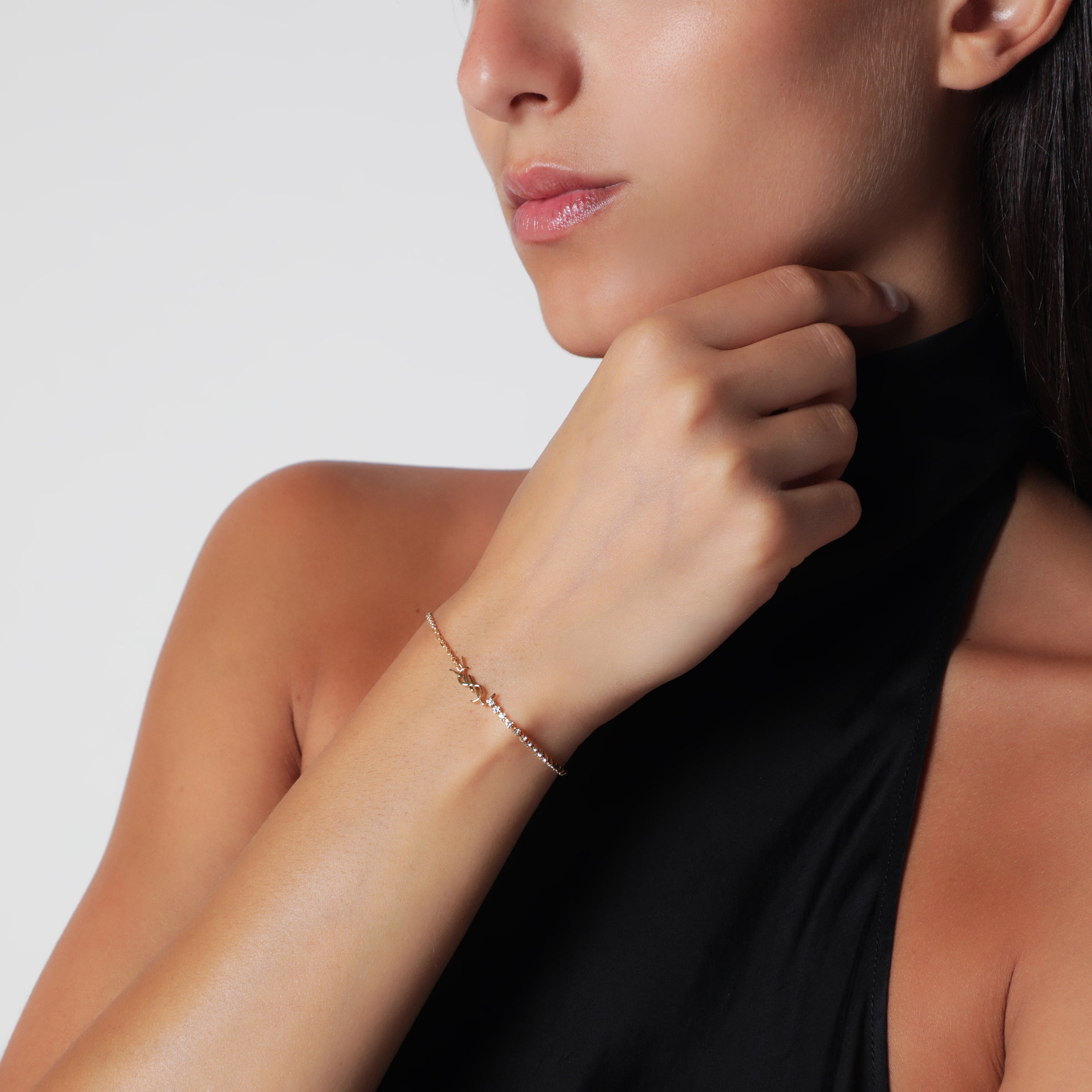 Saint Laurent Cassandre charm bracelet in gold-tone metal | TheDoubleF