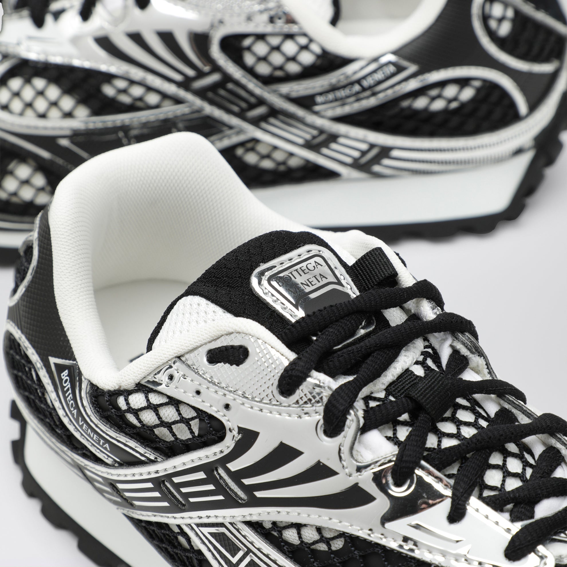 Sneakers Orbit noires/argentées en tissu technique