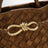 Small Andiamo handbag in caramel woven suede