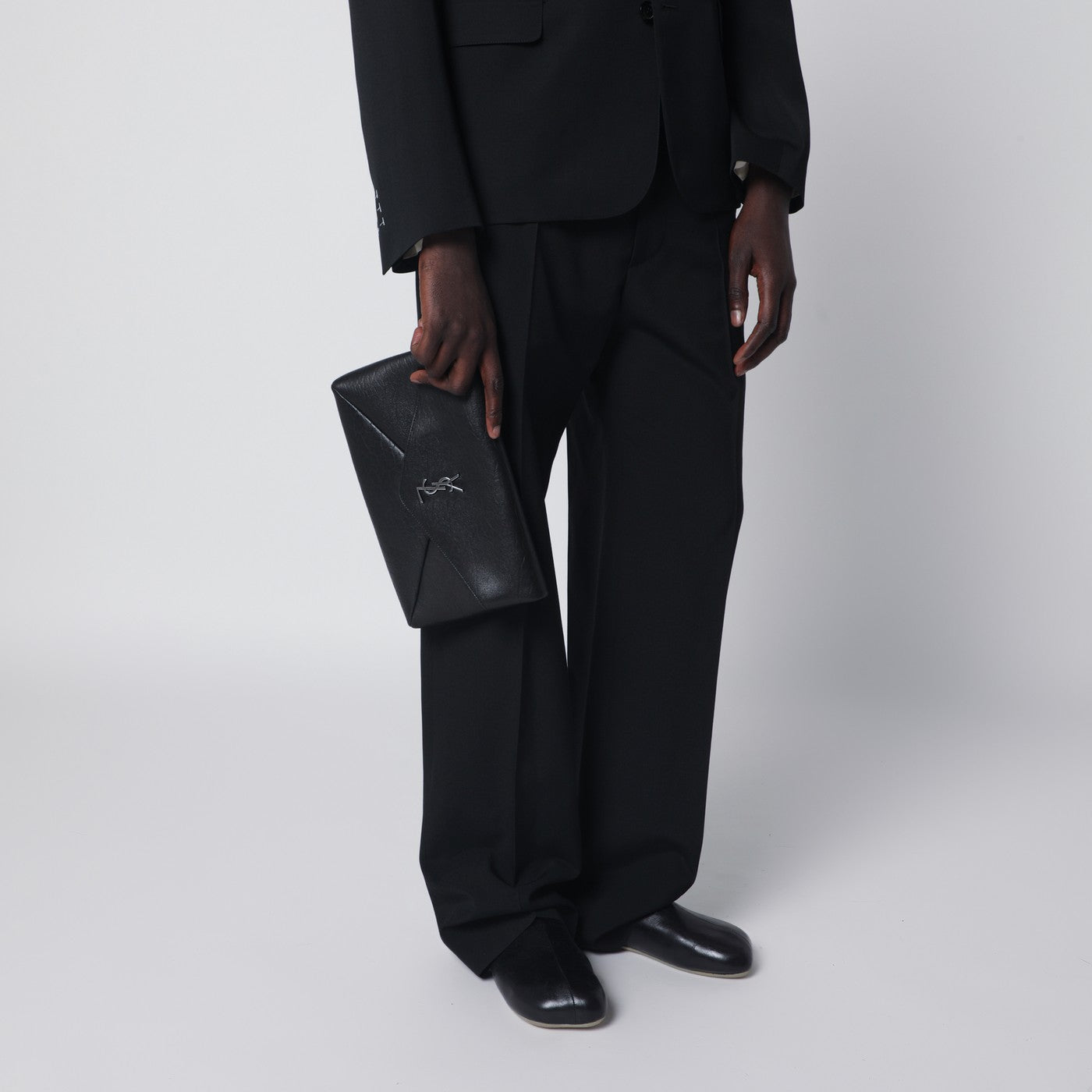 Cassandre large black Envelope clutch bag with logo