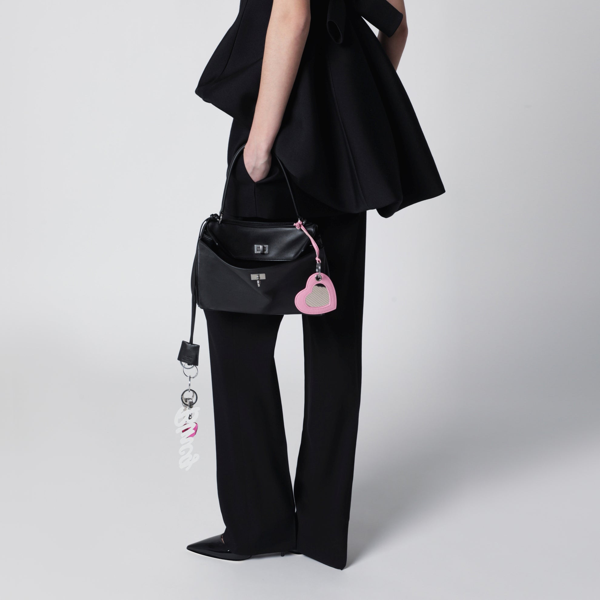 Small black Rodeo bag in smooth calf leather with charm
