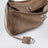 Petit sac Rodeo en cuir de veau suédé sésame