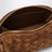 Pochette Concert tressée en cuir ambre