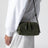 Pochette Concert intrecciata in pelle verde