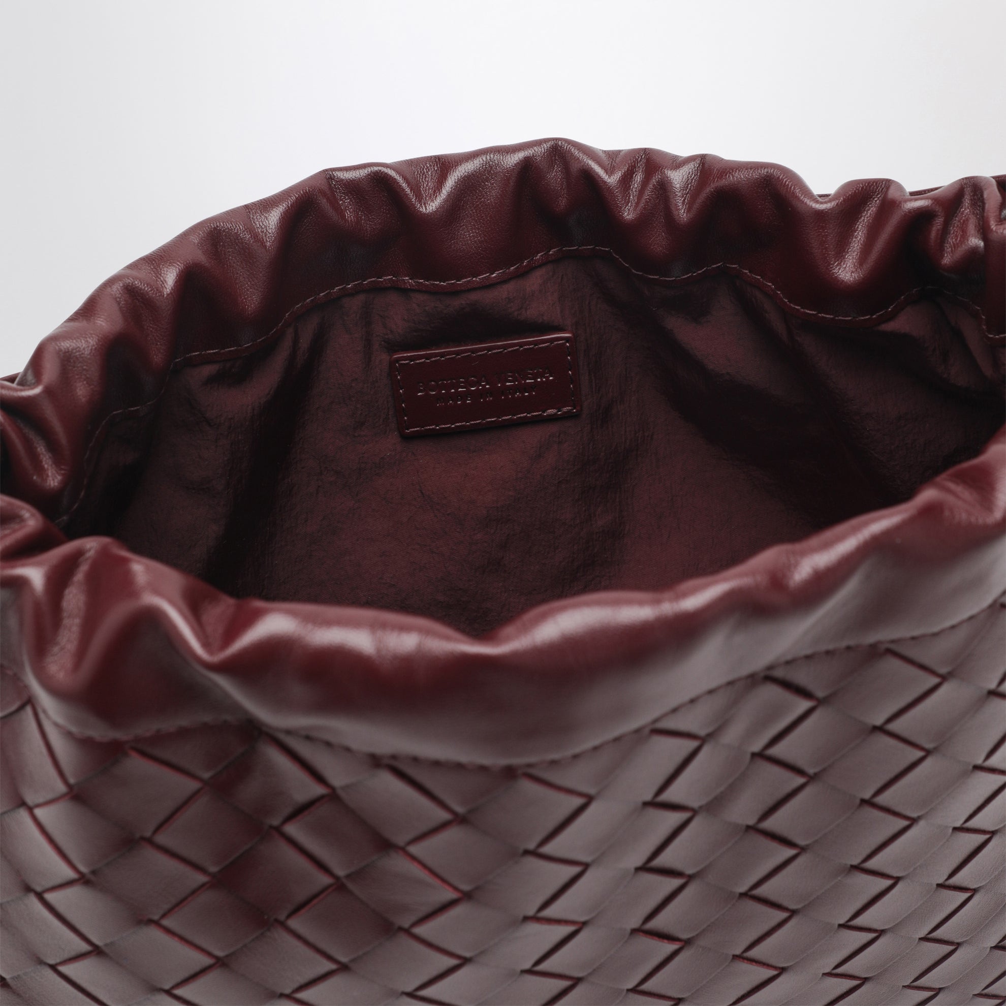 Dustbag moyen en cuir Intrecciato coloris Barolo