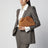 Dustbag en daim Intrecciato couleur ambre