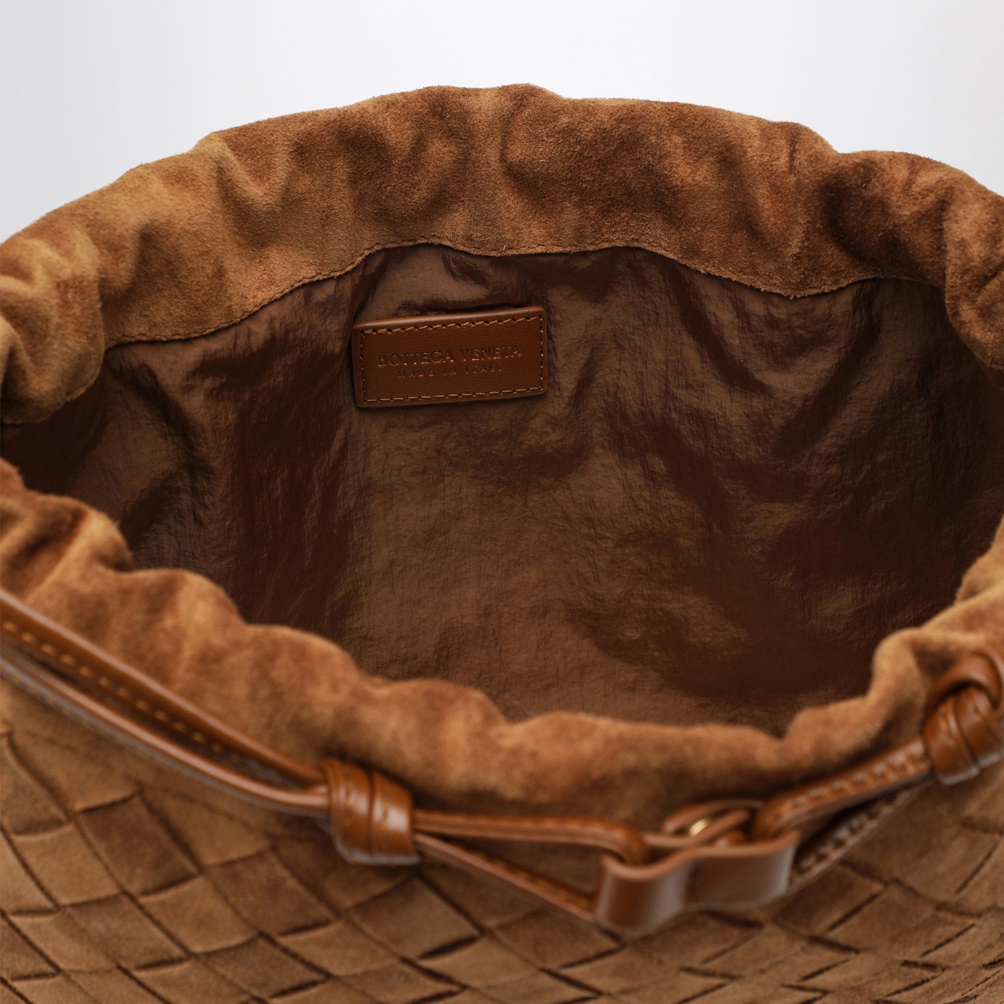 Dustbag en daim Intrecciato couleur ambre