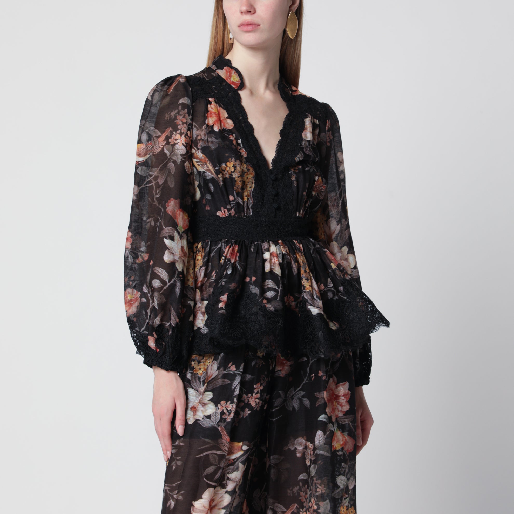 Blusa a peplo in pizzo Carousel nera