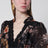 Blusa a peplo in pizzo Carousel nera