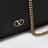 VLogo Signature grained calfskin clutch in black