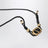 Bracciale con cordino nero e logo V smaltato oro