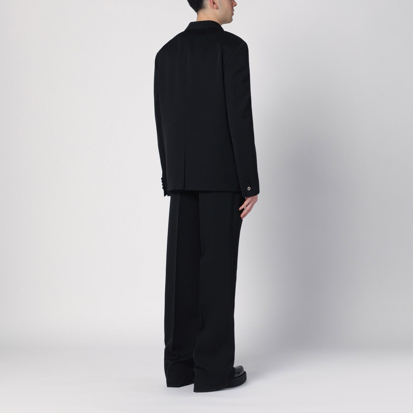 Black double-breasted wool suit