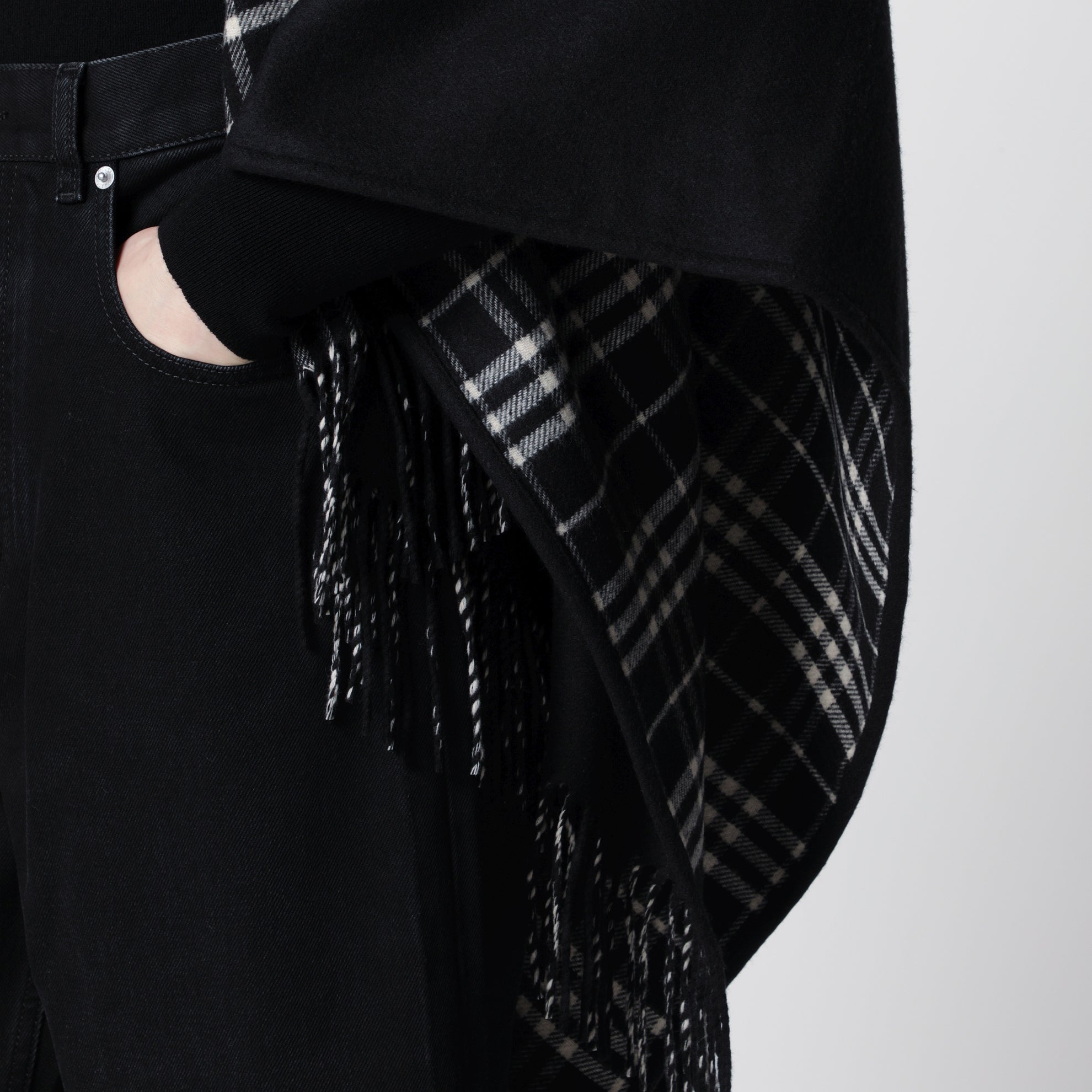 Reversible wool check cape with fringes in black