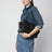 Niki Tripouch black leather shoulder bag