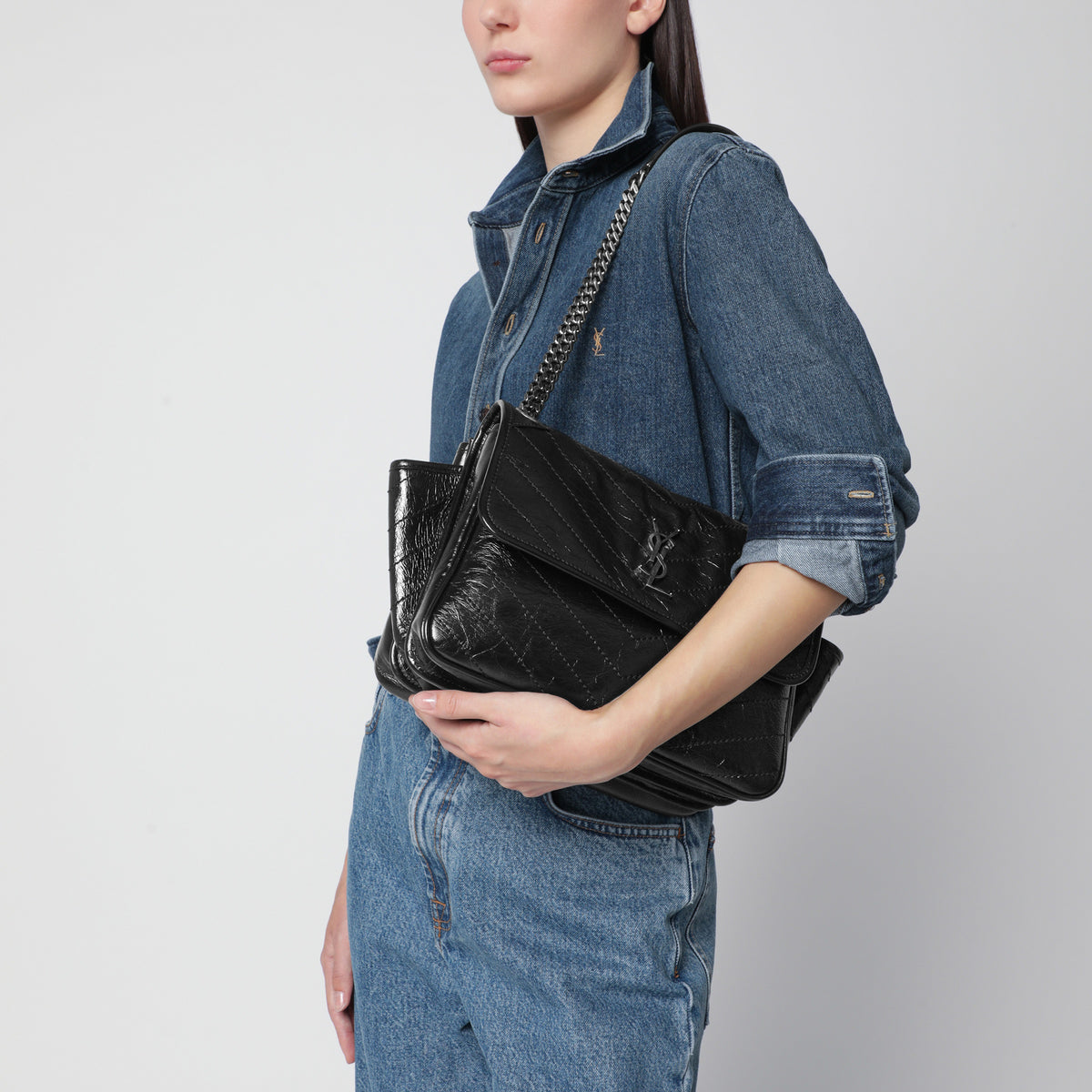 Niki Tripouch black leather shoulder bag
