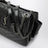 Niki Tripouch black leather shoulder bag