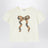 T-shirt ivoire avec nœud et motif à carreaux
