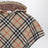 Sand-coloured wool cape with a checked pattern