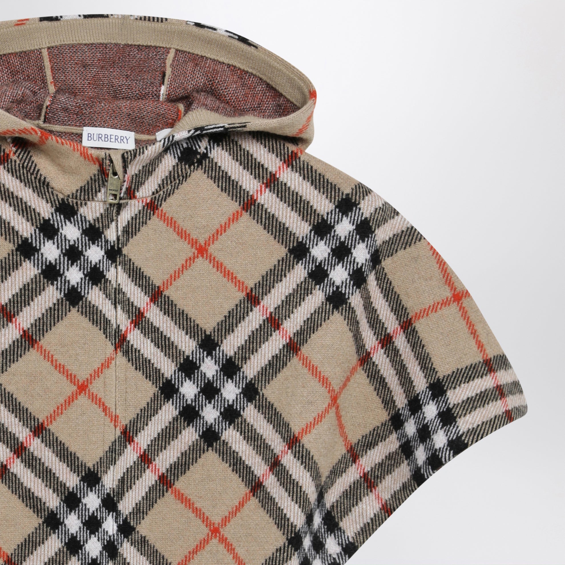 Sand-coloured wool cape with a checked pattern