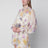 Cream short jumpsuit with floral pattern
