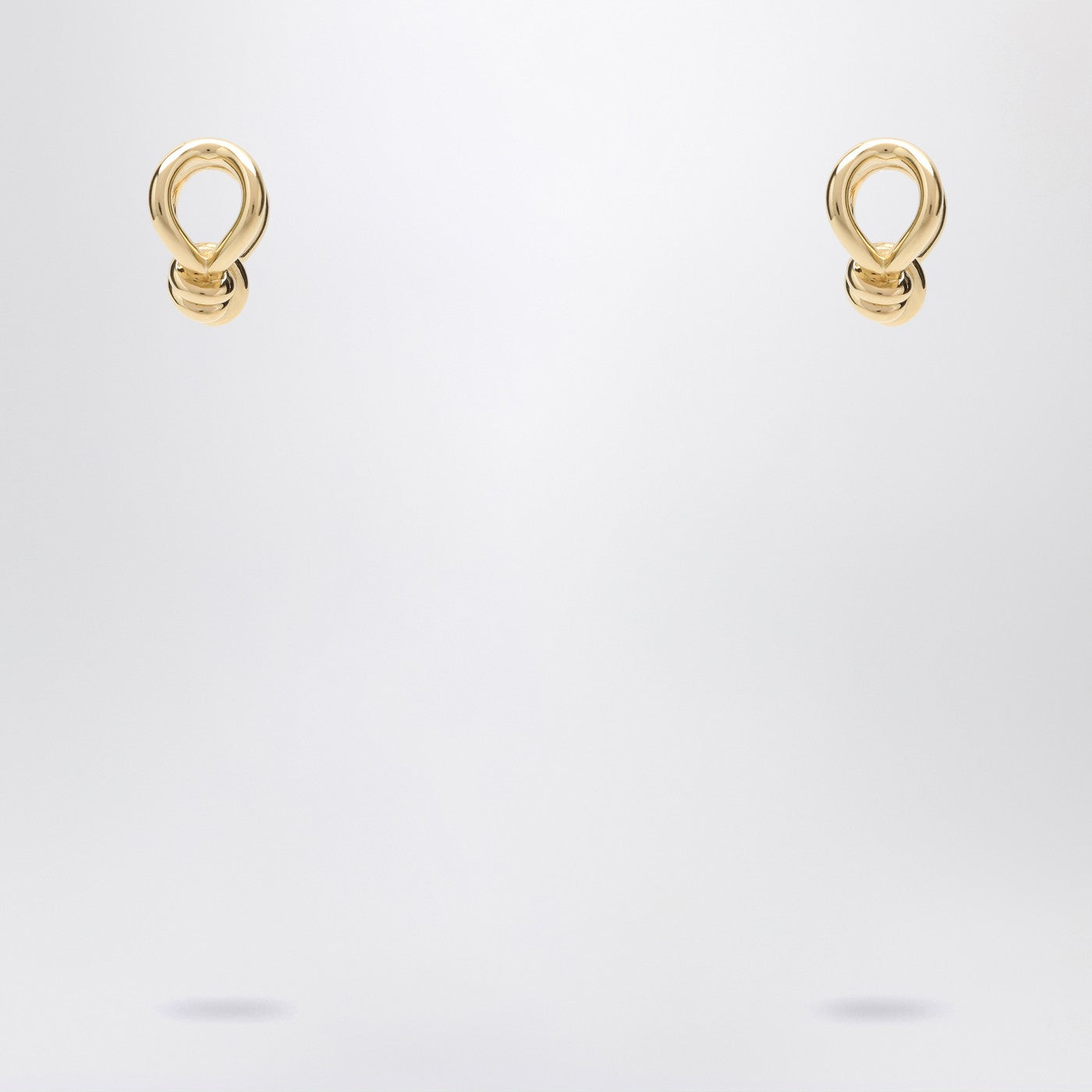 Gold earrings with Knot detail.