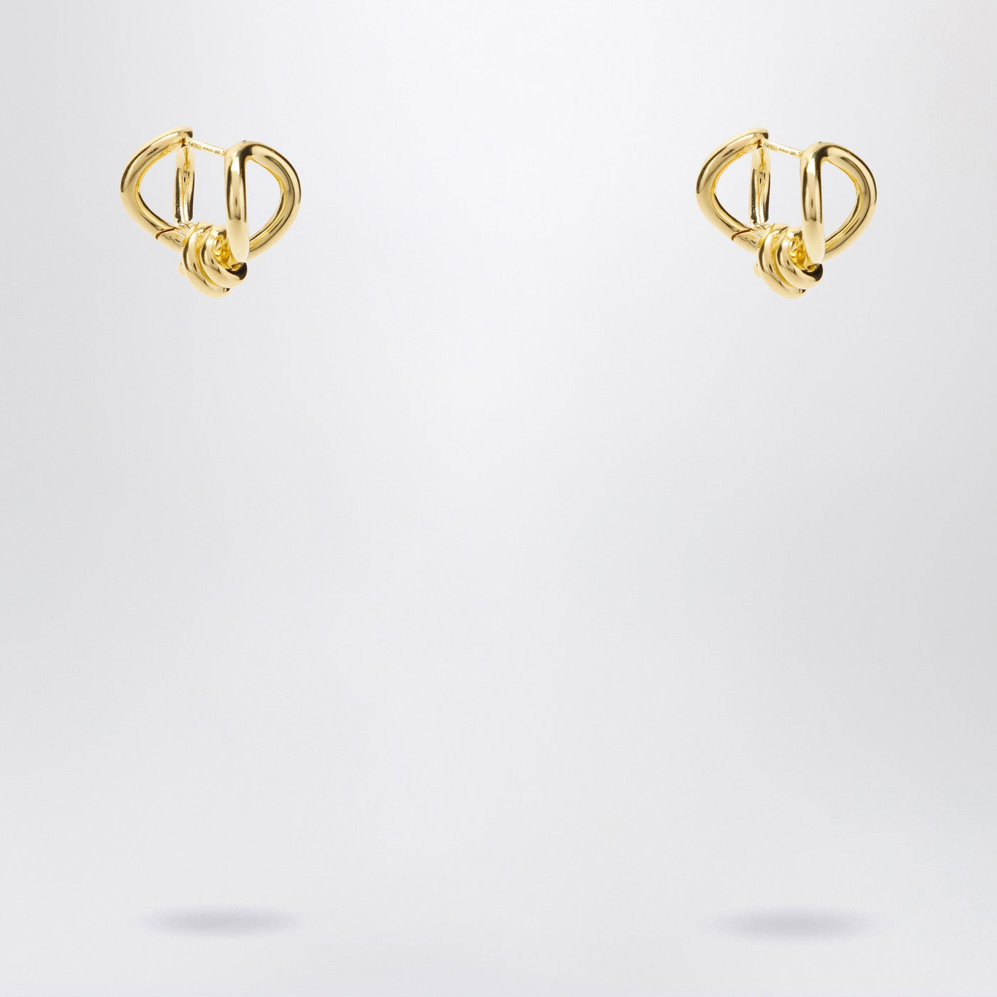 Gold earrings with Knot detail.