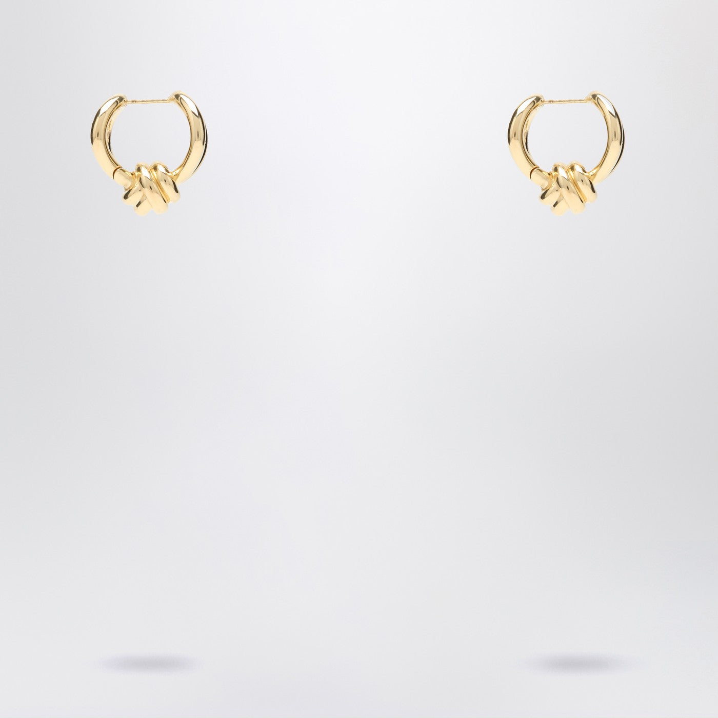 Gold earrings with Knot detail.