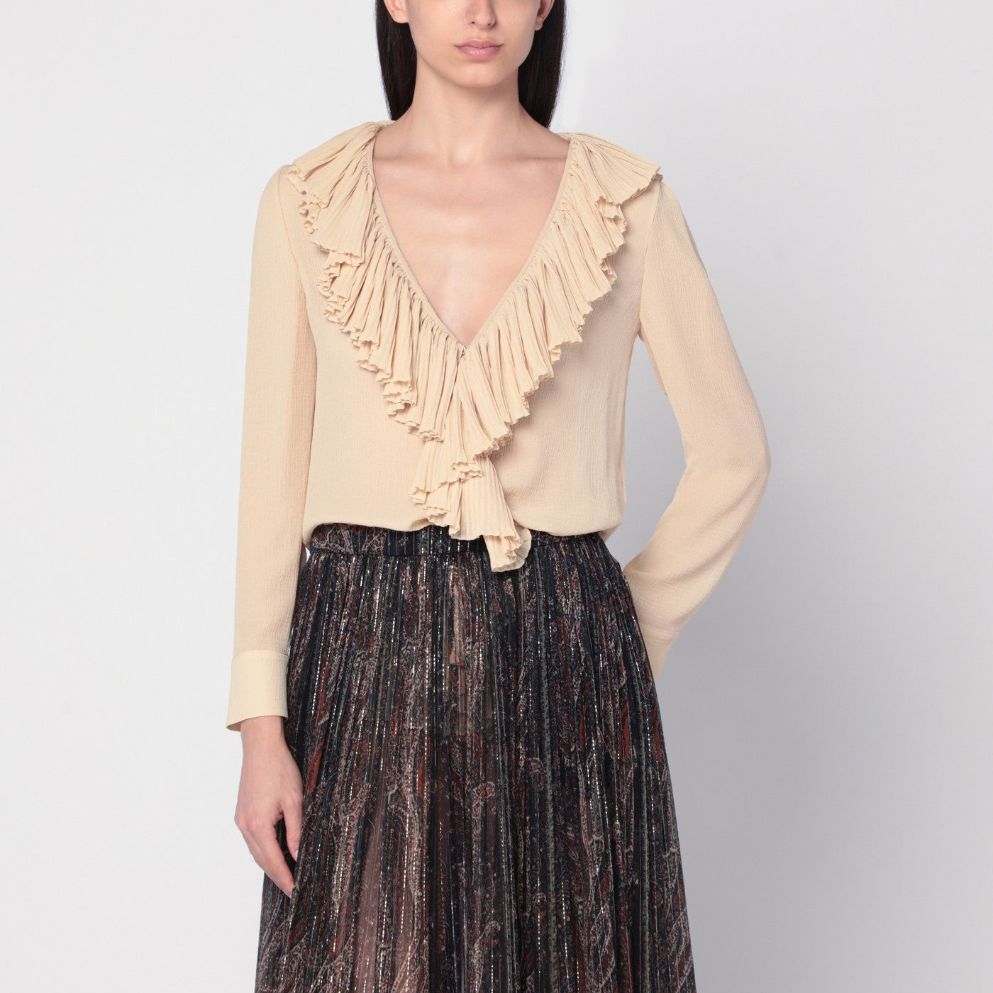 Beige ruffled blouse in silk