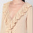 Beige ruffled blouse in silk