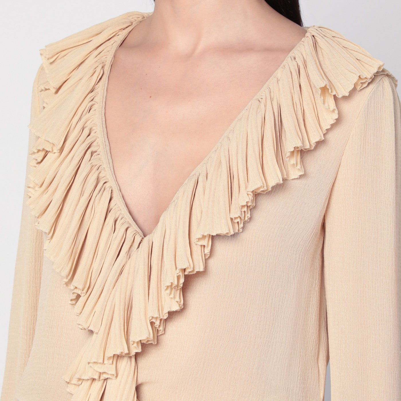 Beige ruffled blouse in silk
