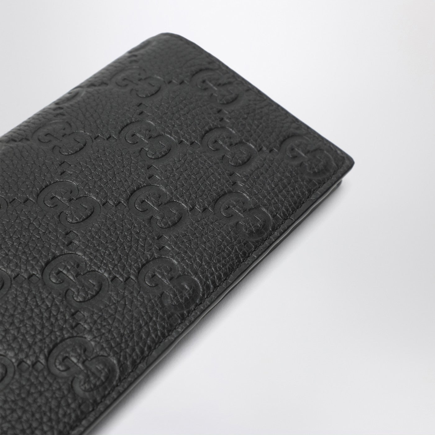 Long vertical wallet in black GG leather