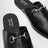 Black leather mules with Horsebit